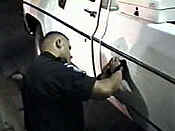 Officer using Mini-Buster to scan car door