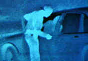 Thermal image of officer looking into a car